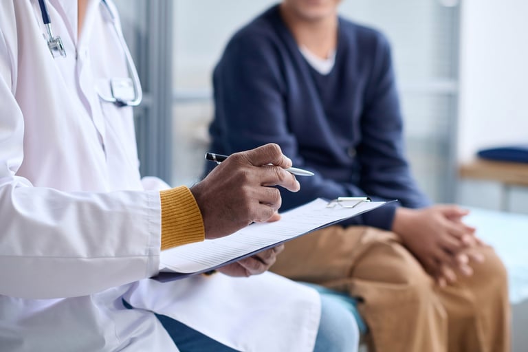 Side view closeup of doctor holding clipboard while consulting child in clinic