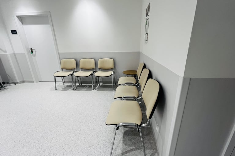 Clean modern hospital corridor with comfortable seating and minimalist design